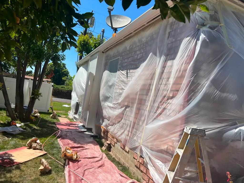 Residential painting prep work before an exterior repaint
